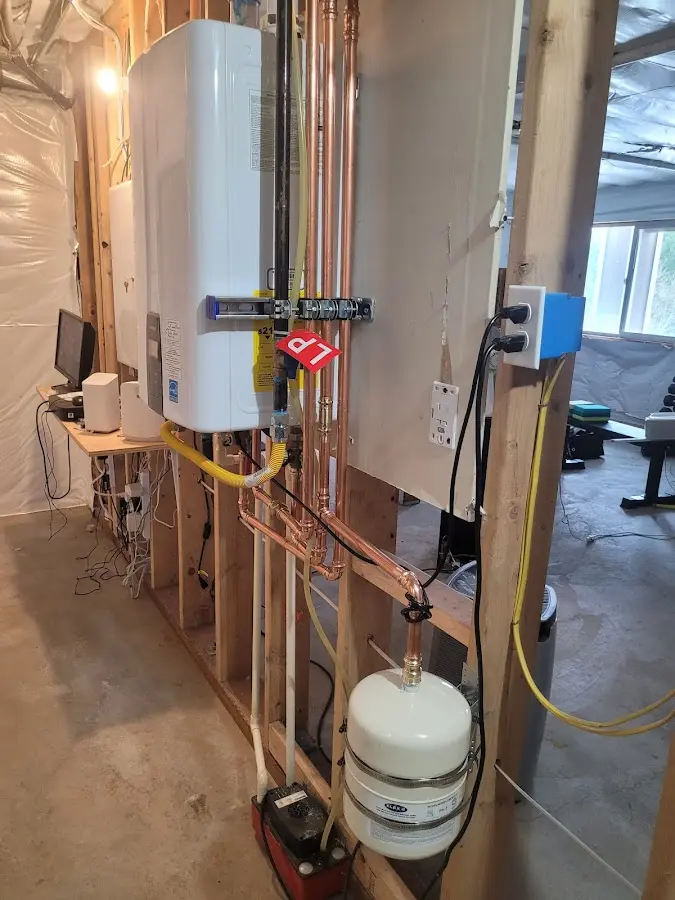 Licensed plumber repairing a kitchen sink in Bloomer